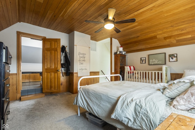 bedroom featuring ceiling fan, wooden ceiling, and wooden walls