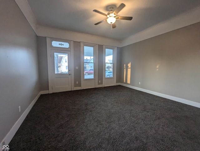 carpeted entrance foyer with ceiling fan