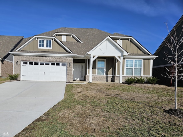 craftsman-style home featuring a garage and a front lawn