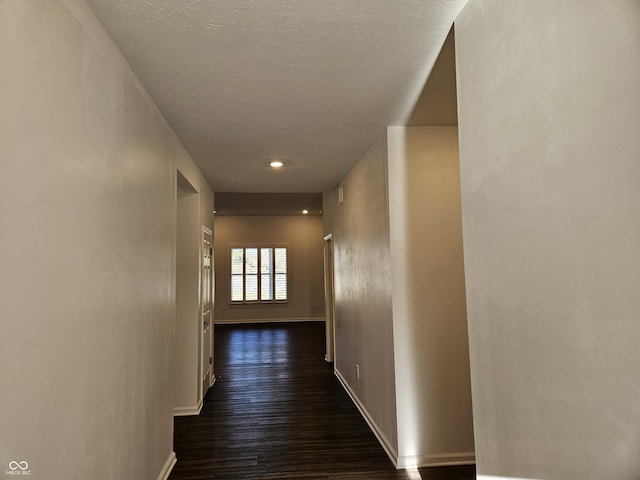 hall with dark hardwood / wood-style flooring