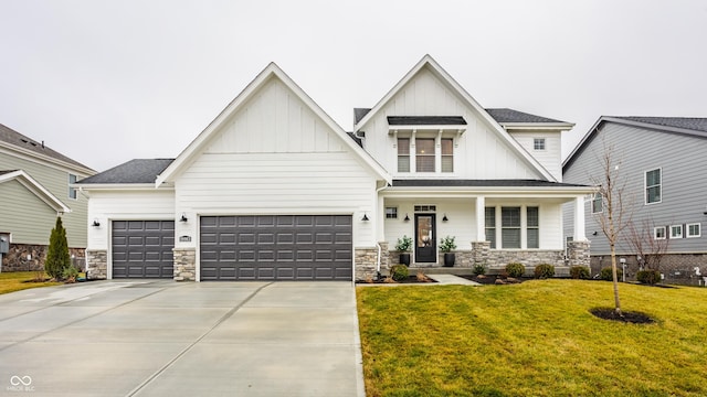 view of front of property with a garage and a front lawn