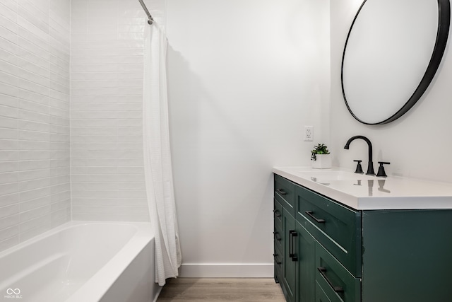 bathroom featuring shower / tub combo with curtain, vanity, and wood-type flooring