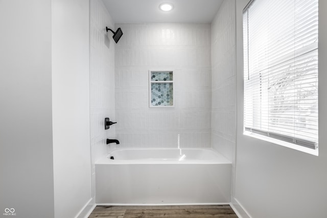 bathroom featuring shower / bath combination and hardwood / wood-style flooring