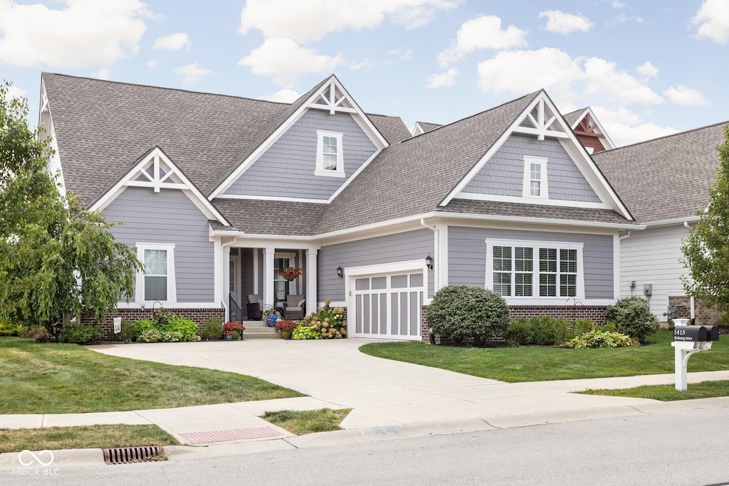 craftsman-style house with a front lawn and a garage