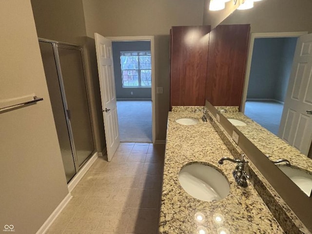 bathroom featuring vanity and an enclosed shower