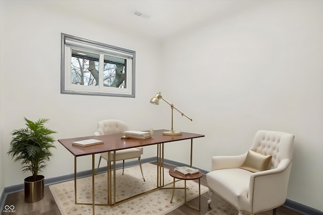 home office with wood-type flooring