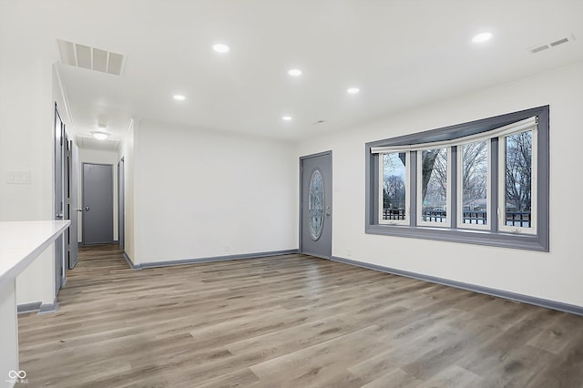 unfurnished living room with light hardwood / wood-style floors