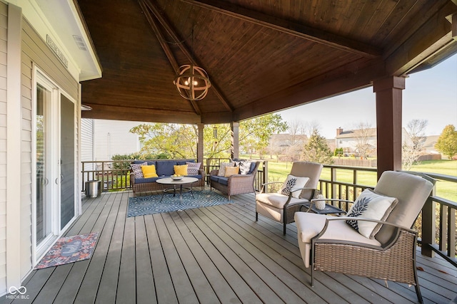 wooden deck with a gazebo and outdoor lounge area