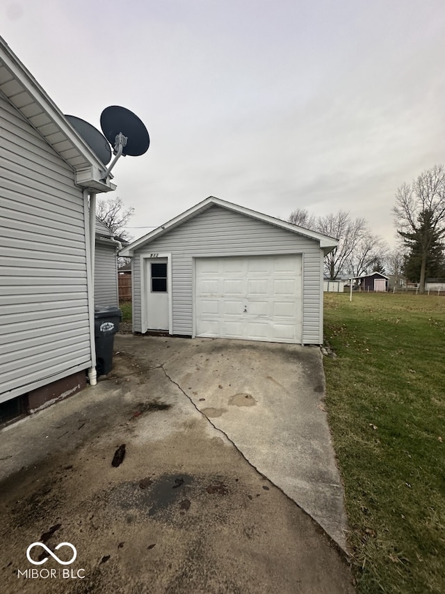 garage featuring a lawn