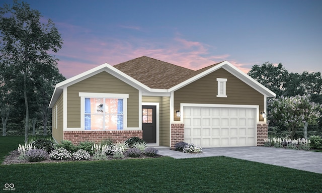 view of front of home featuring a lawn and a garage