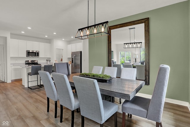 dining space with light wood-type flooring