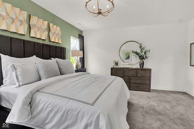 carpeted bedroom featuring a chandelier