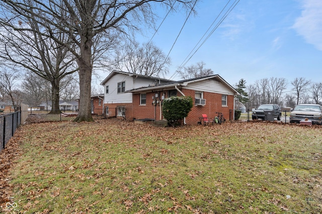 view of side of property featuring a lawn