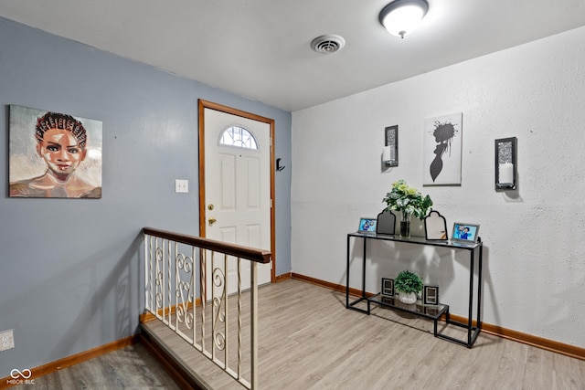 entrance foyer featuring hardwood / wood-style flooring