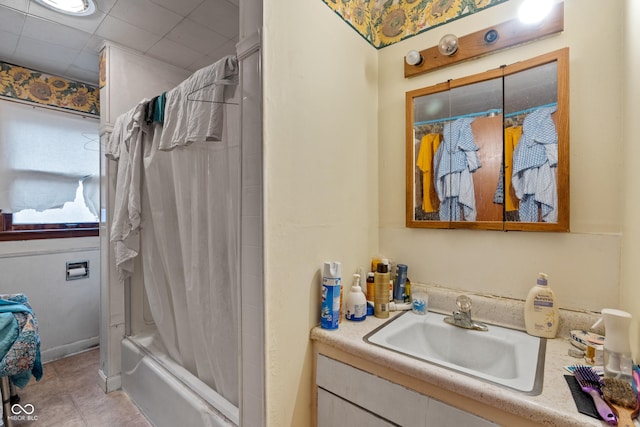 bathroom featuring vanity, tile patterned flooring, and shower / bath combo with shower curtain