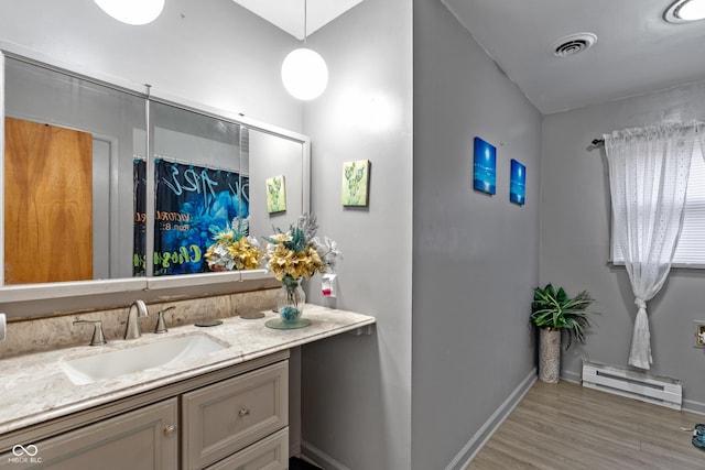 bathroom featuring hardwood / wood-style flooring, a baseboard radiator, vanity, and a shower with curtain