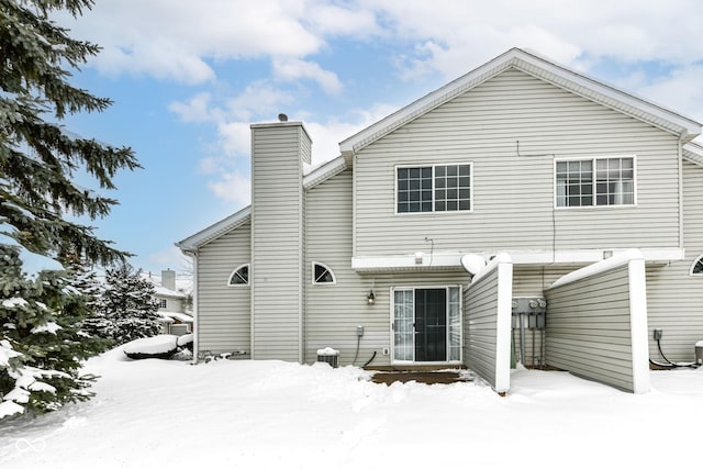 view of snow covered house