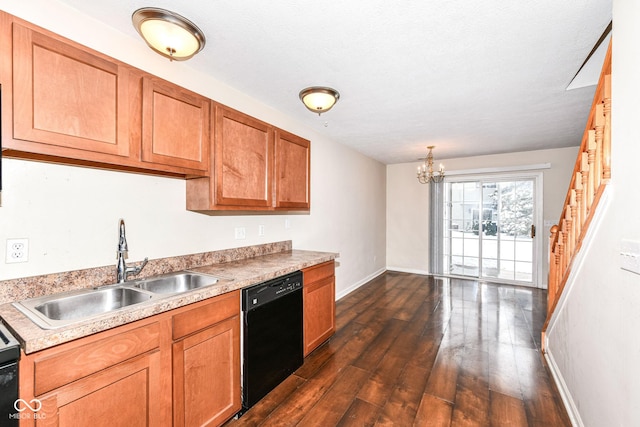 kitchen featuring dark wood-type flooring, sink, a textured ceiling, black dishwasher, and a chandelier