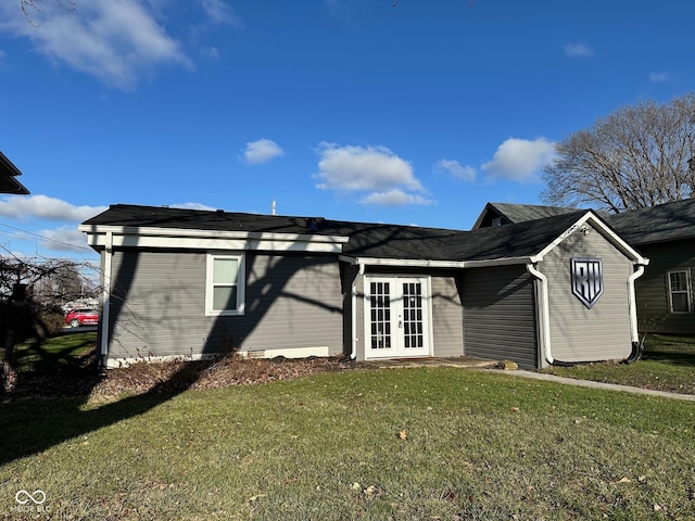 single story home with a front yard and french doors