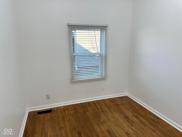 unfurnished room featuring hardwood / wood-style floors