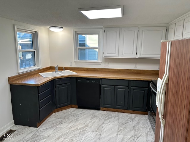 kitchen featuring white cabinetry, dishwasher, range with electric cooktop, sink, and white fridge