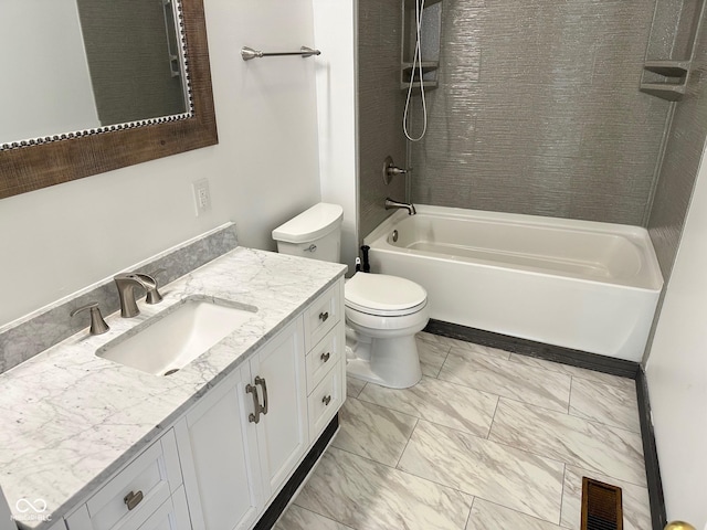 full bathroom with vanity, tiled shower / bath combo, and toilet