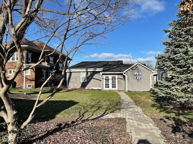 exterior space with a yard and french doors