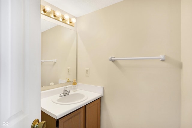 bathroom featuring vanity and a textured ceiling