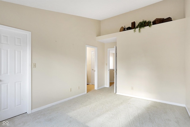 empty room featuring light colored carpet