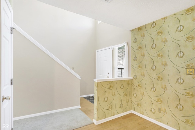 clothes washing area with hardwood / wood-style floors