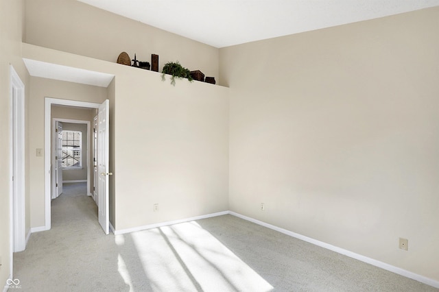 empty room with light colored carpet