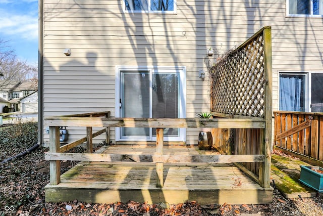 rear view of house featuring a deck