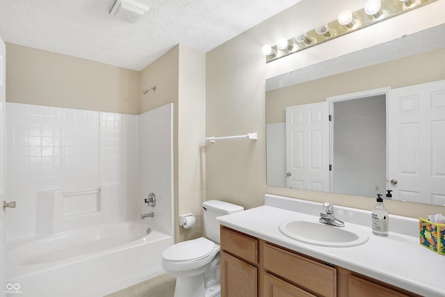 full bathroom featuring vanity, toilet, a textured ceiling, and bathing tub / shower combination