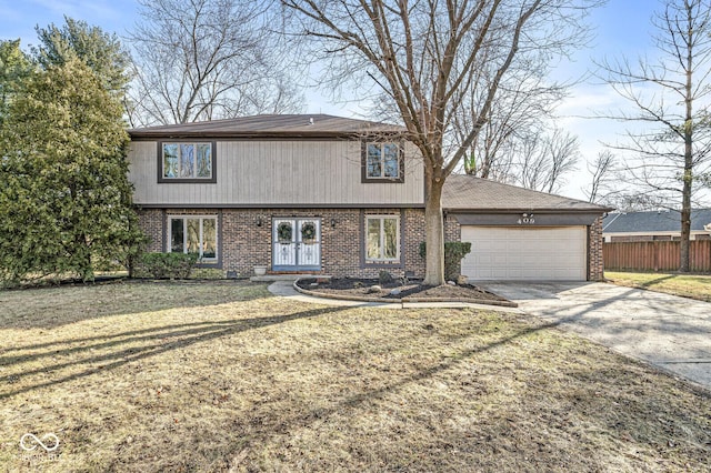 view of front property with a front yard and a garage