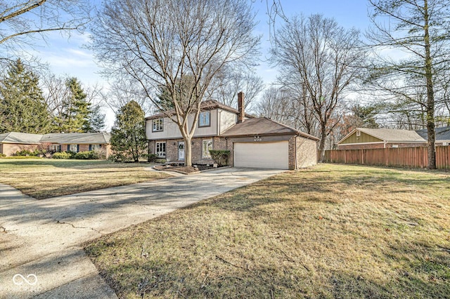 view of front of home with a garage and a front yard