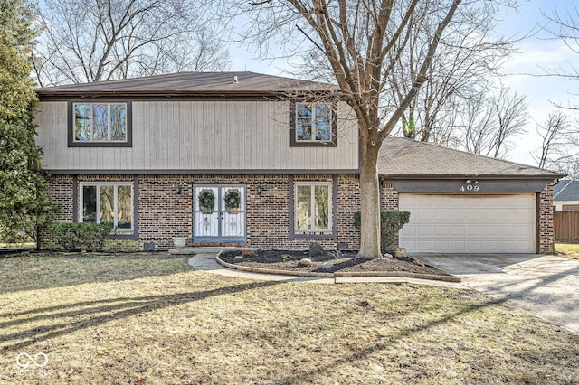 front facade with a front yard and a garage