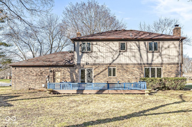 back of house with a yard and a deck