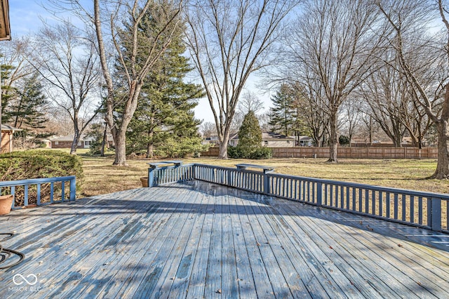 wooden terrace with a lawn