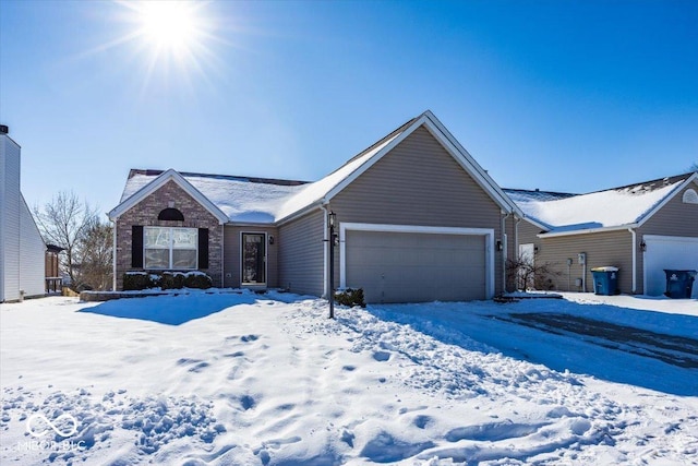 ranch-style home featuring a garage