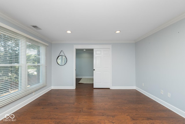 empty room with dark wood-type flooring and crown molding