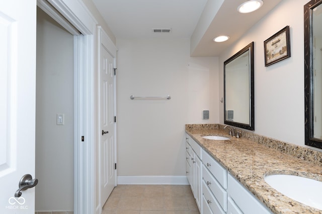 bathroom featuring tile patterned floors and vanity