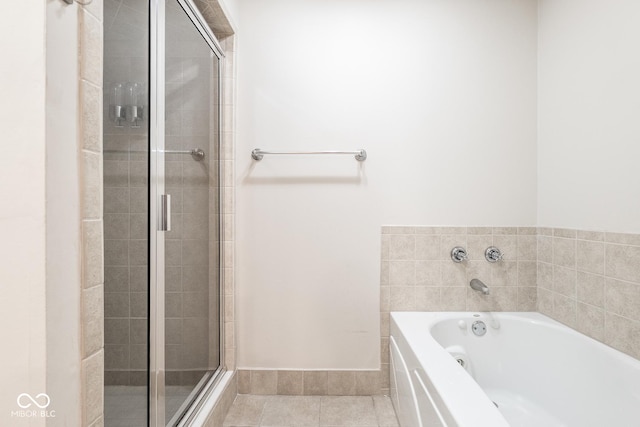 bathroom with tile patterned flooring and plus walk in shower