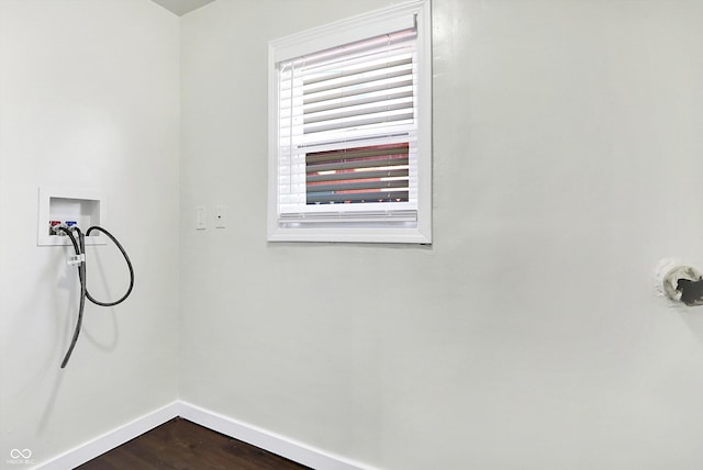 clothes washing area with hardwood / wood-style floors and hookup for a washing machine