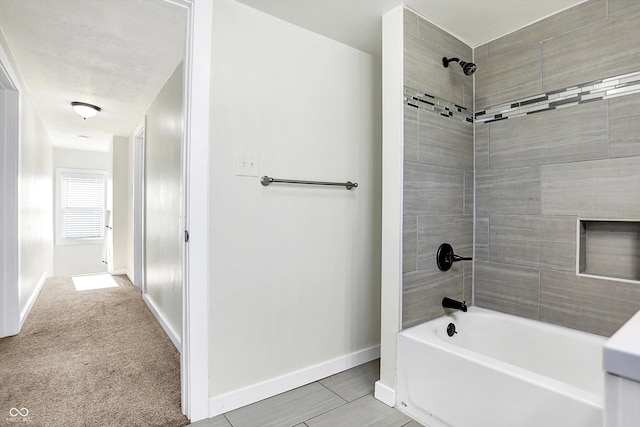 bathroom featuring tiled shower / bath combo