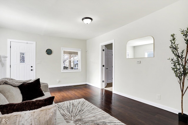 living room with dark hardwood / wood-style floors