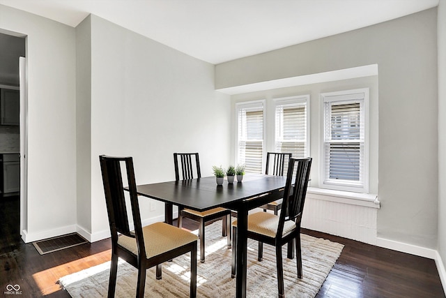 dining area featuring dark hardwood / wood-style flooring