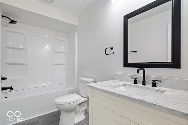 full bathroom featuring vanity,  shower combination, and toilet