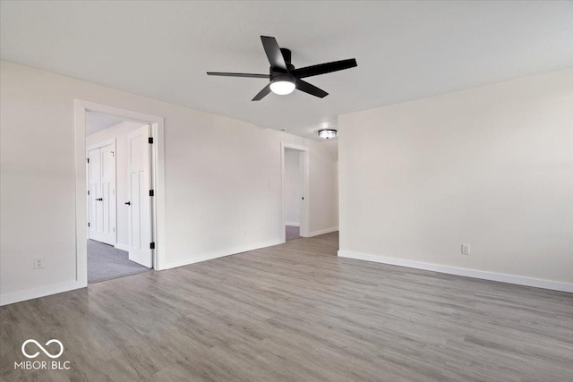 spare room with wood-type flooring and ceiling fan