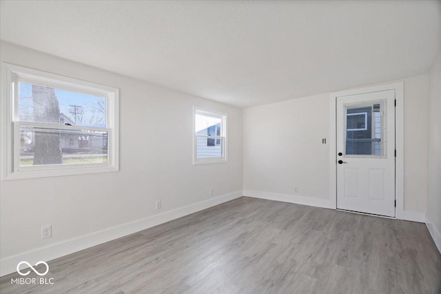 unfurnished room featuring light wood-type flooring