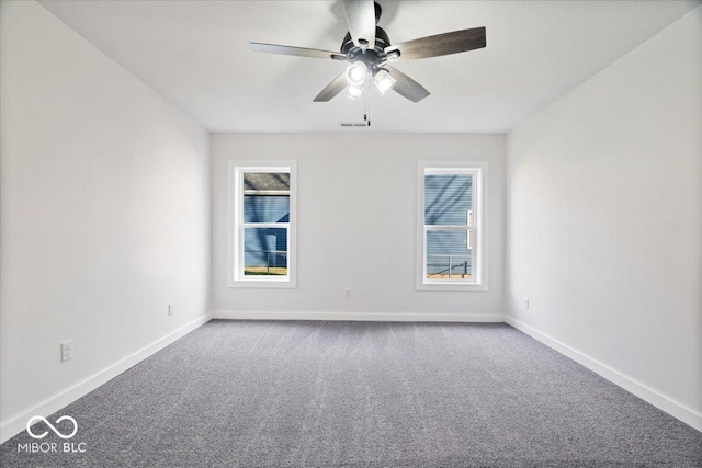 unfurnished room with carpet and ceiling fan